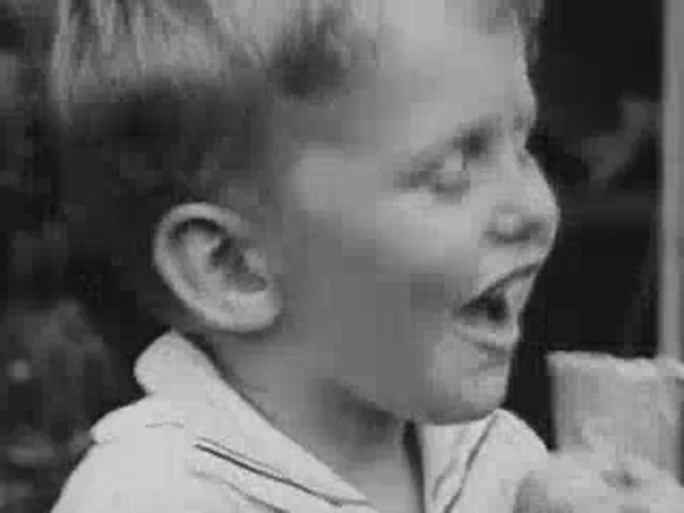 A boy laughing at Coney Island, 1940